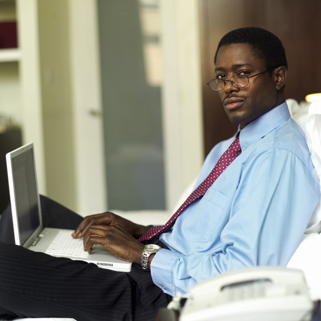 Well dressed handsome man with laptop